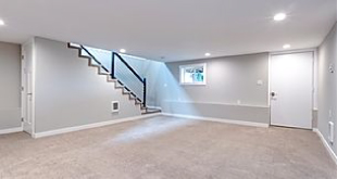 basement remodeling project with fresh paint, new sheetrock and lighting