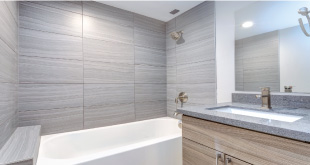 bathroom remodeling with new tiles, tub, sink and faucet